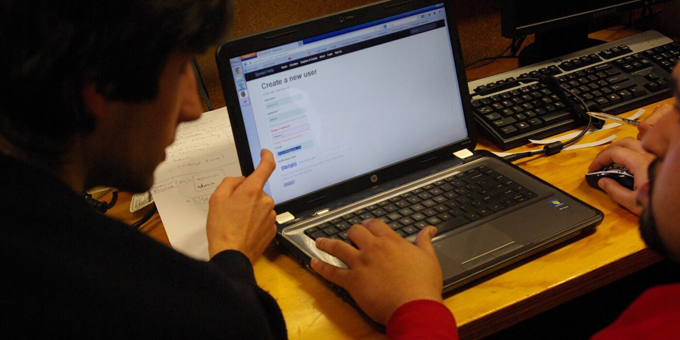 Usability testing for beginners: a researcher watches a participant try a website at a desk